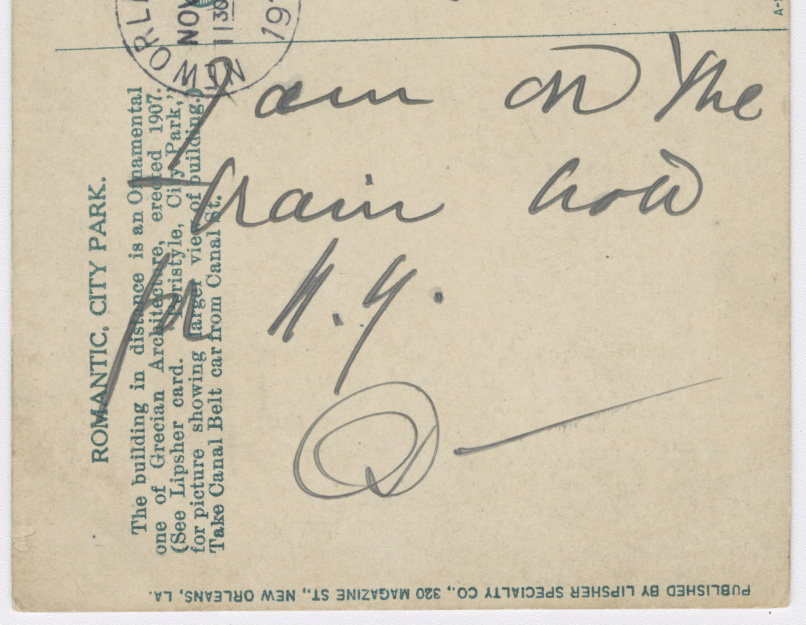 Handwriting on a brown postcard reads "I am on the train now for N.Y. D—"