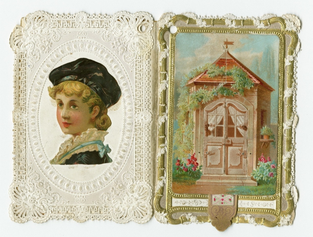 Front and back of a 3-D pop-up card. The back features and illustration of a young boy in a black cap. The front features a small cottage.