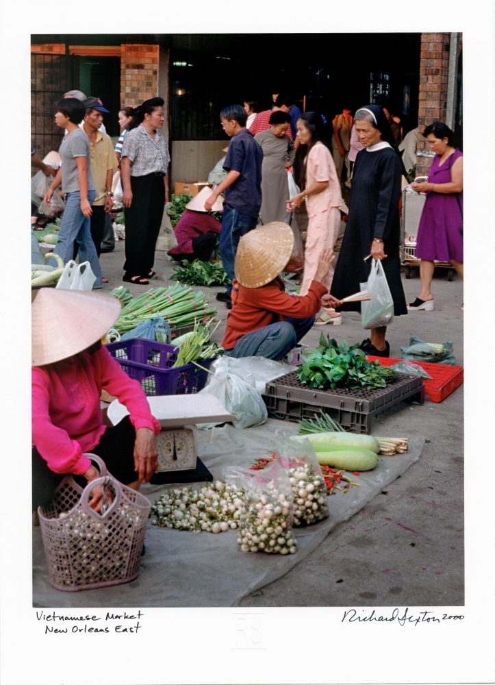 Vendors sell vegetables at the weekly farmer's market in New Orleans East's Vietnamese community.