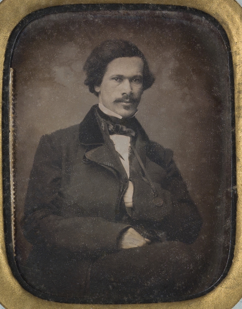 Quarter plate (4 ¼" x 3 ¼") daguerreotype portrait of Dr. Louis Charles Roudanez in passe-partout mount, with spine, intended to open and close like a book.