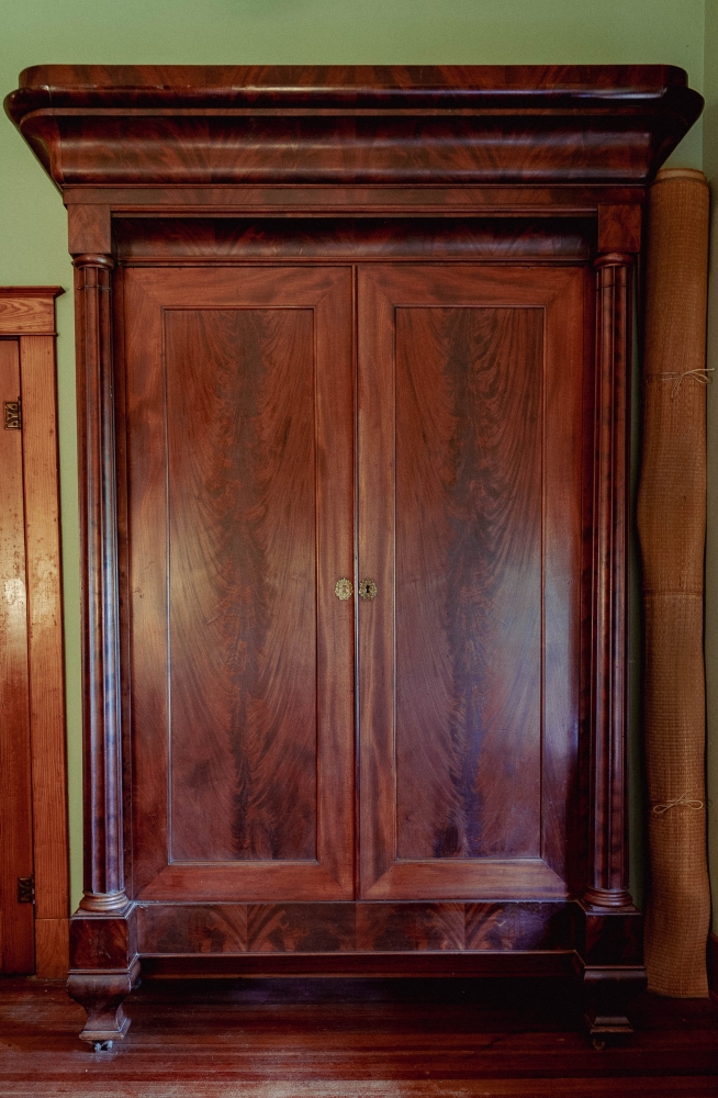 A large mahogany armoire.