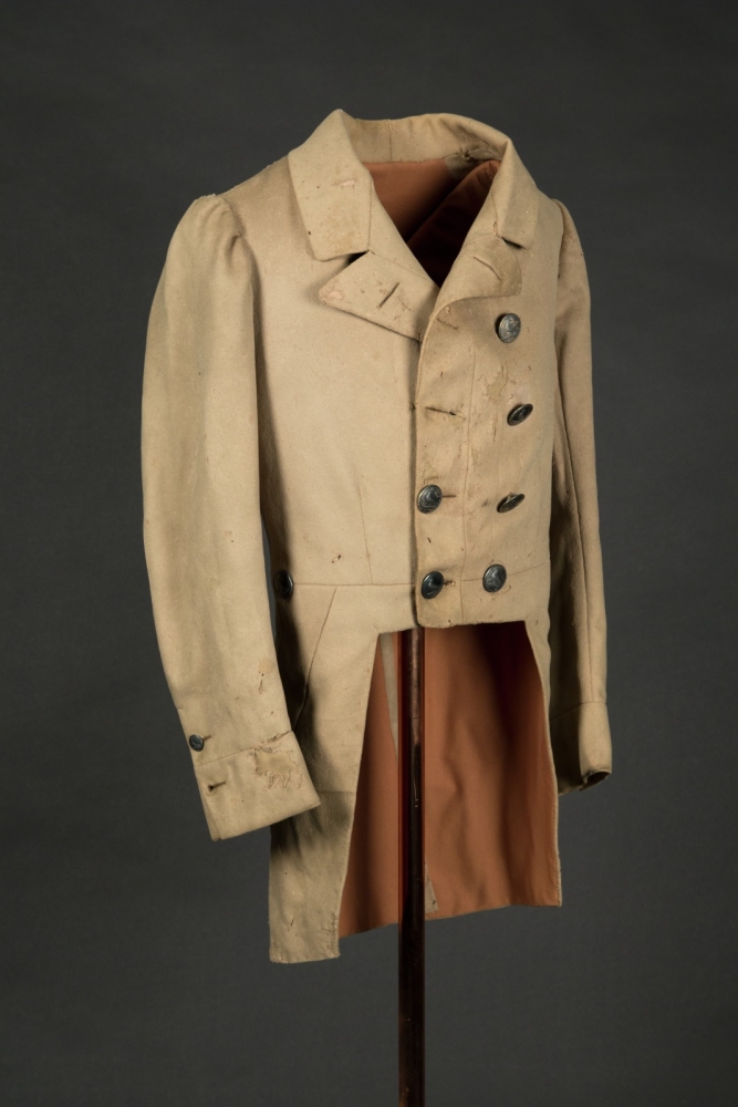 Tan livery jacket with silver buttons
