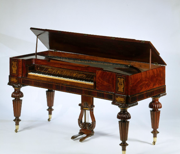 Photograph of an ornate wooden square piano
