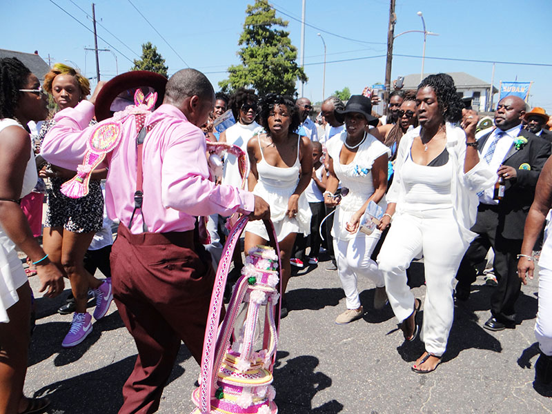 Cheryl Ann Roberts (middle), Nikisha Grinstead (left) and Shelia Ross (right)dance at Kenneth Dykes' funeral