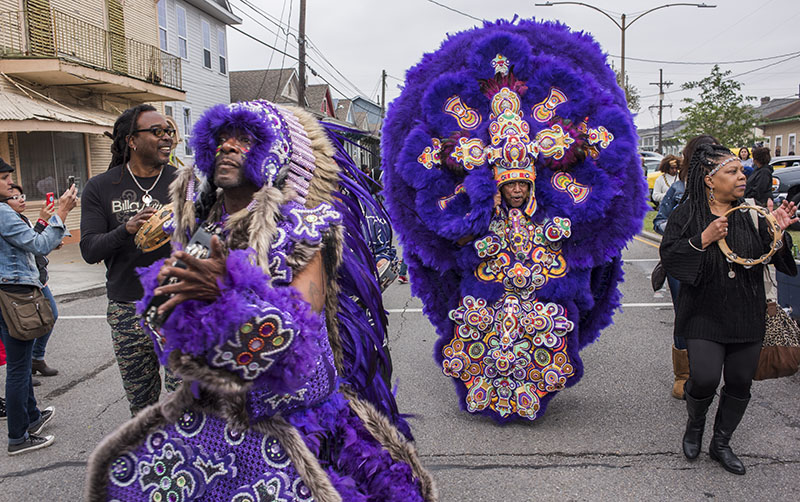 Wildman Larry Terrance (left) and Big Chief Tyron 'Pie' Stevenson (center) of the Monogram Hunters on Carnival day